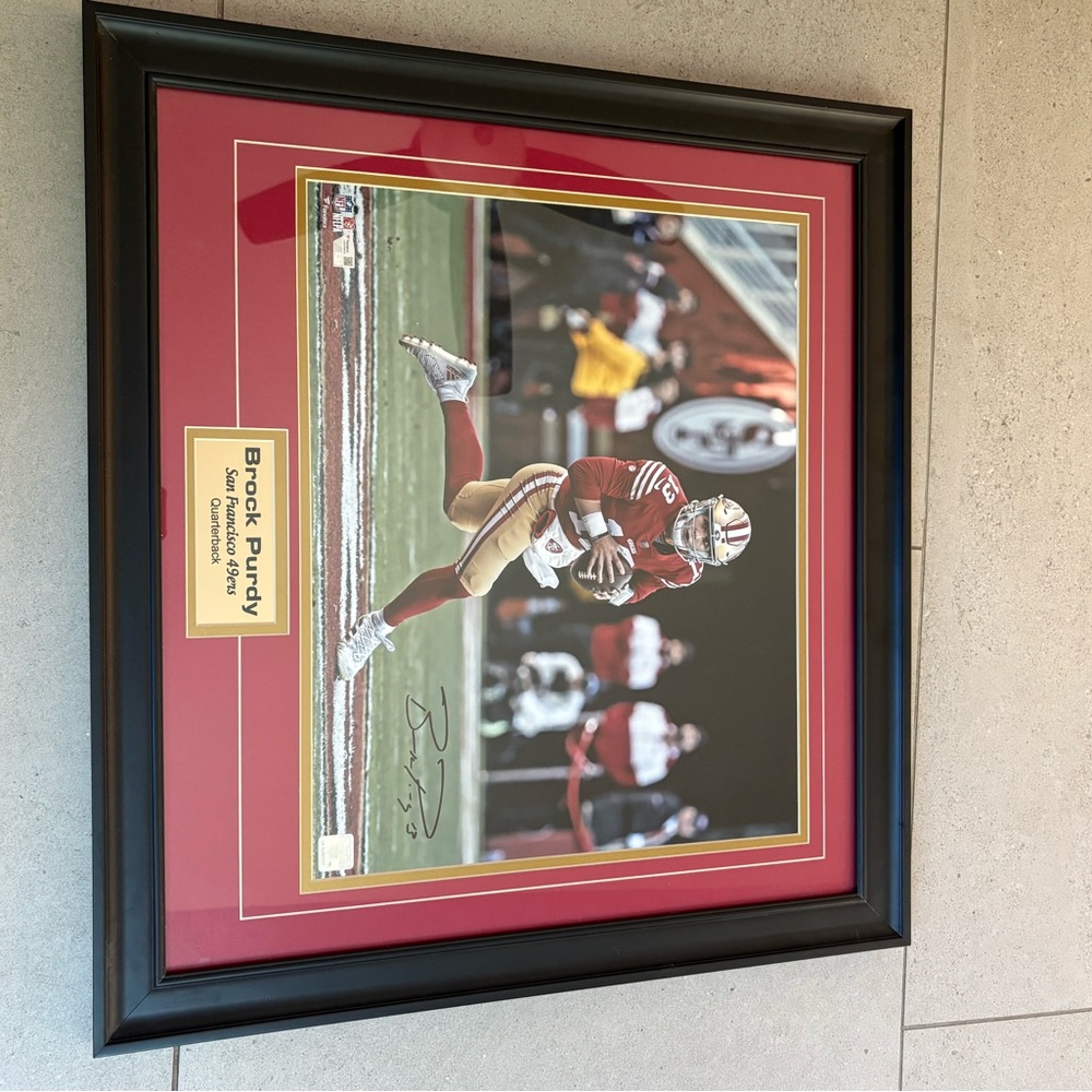 Framed Sports Memorabilia with Red and Black Accents